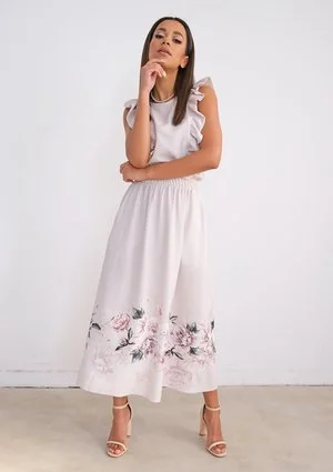 Light-coloured dress with flower print and frills