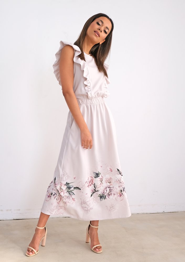 Light-coloured dress with flower print and frills