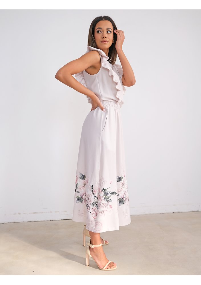 Light-coloured dress with flower print and frills