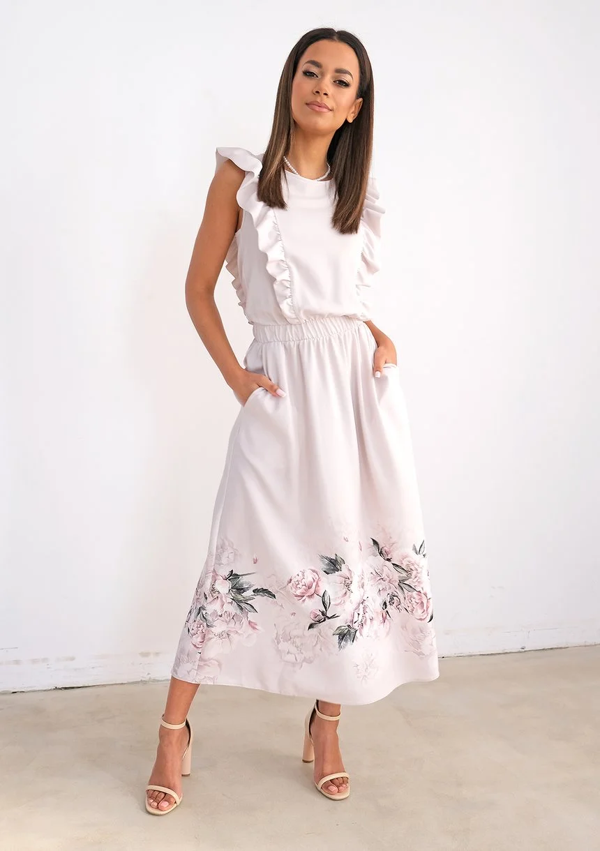 Light-coloured dress with flower print and frills