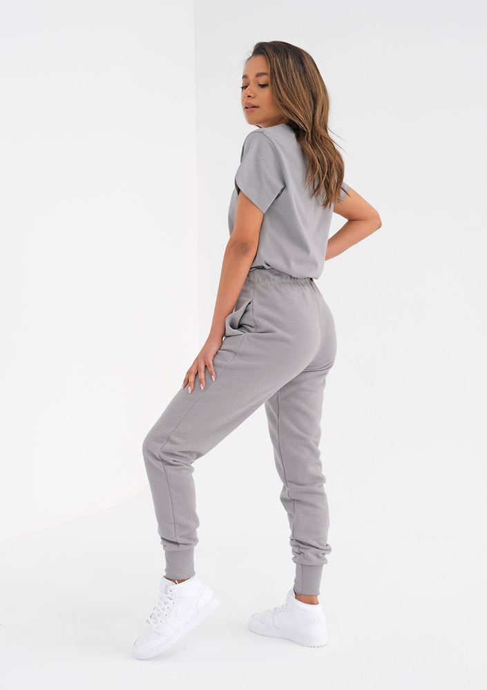 Grey sweatpants with a lime logo