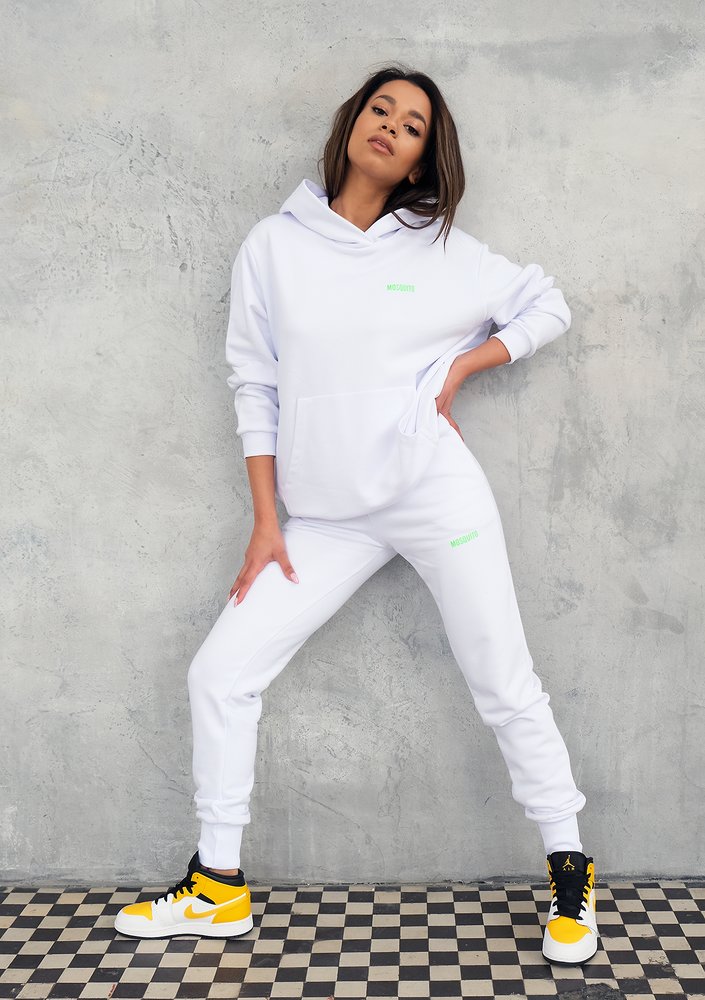 White sweatpants with a lime logo