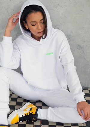 White sweatpants with a lime logo