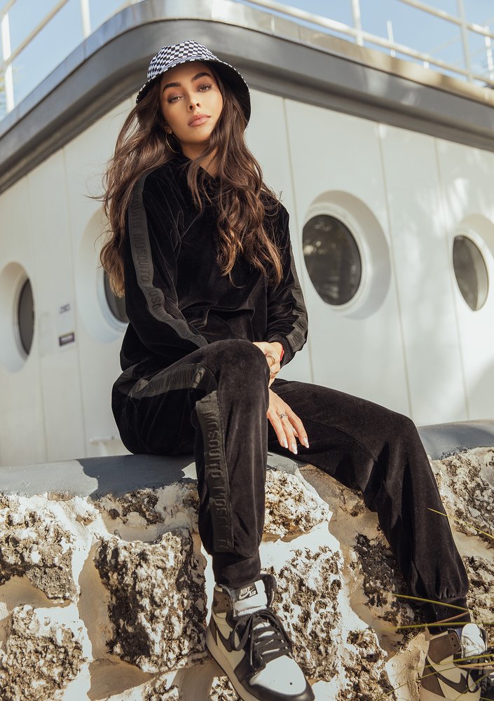 Black velvet sweatpants with stripes