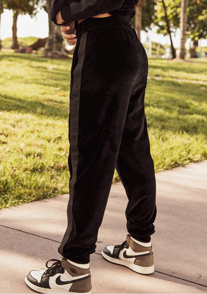 Black velvet sweatpants with stripes