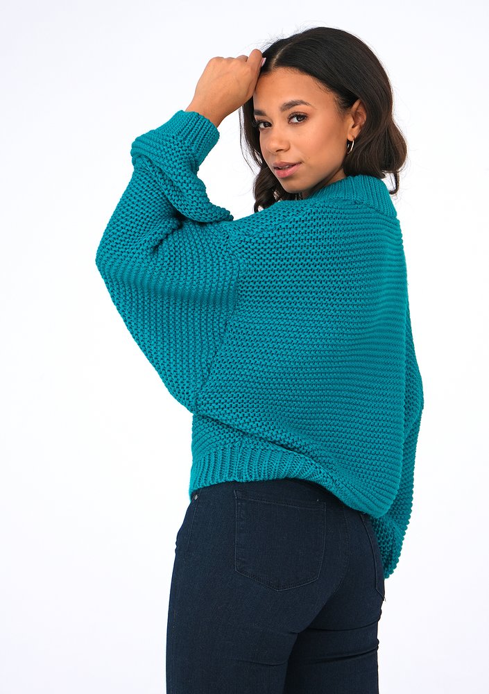 Loose green sweater