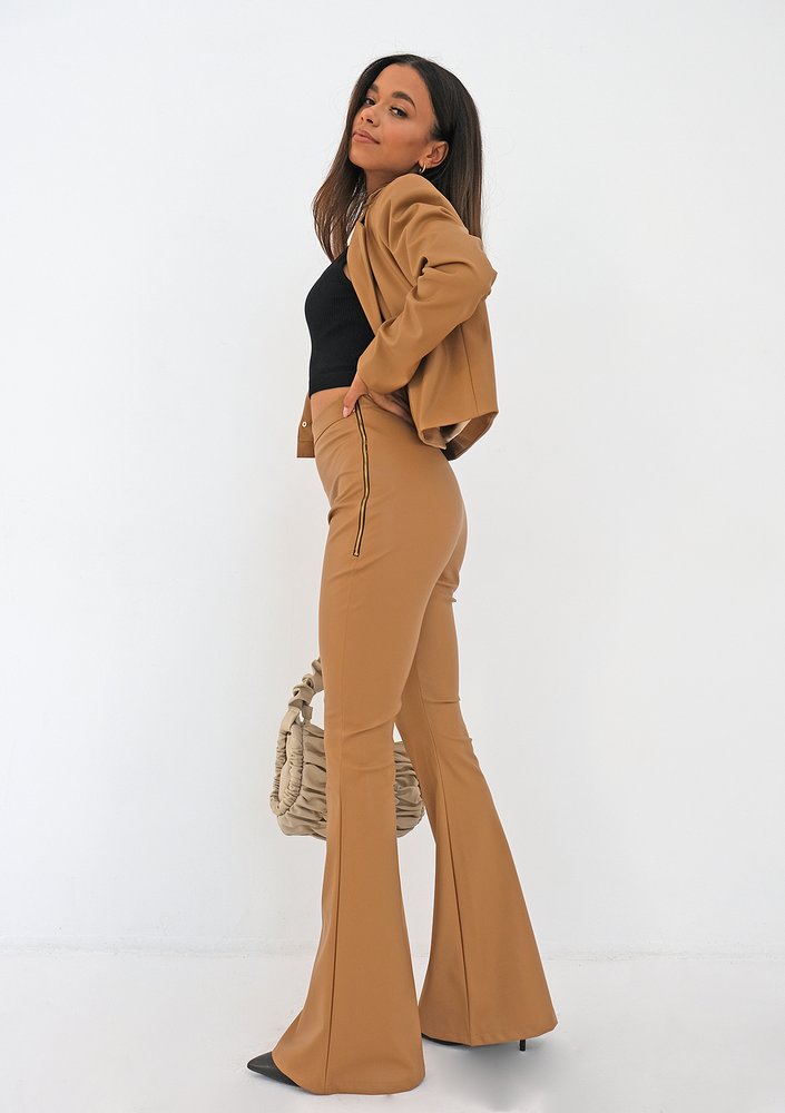 Beige eco leather flared trousers
