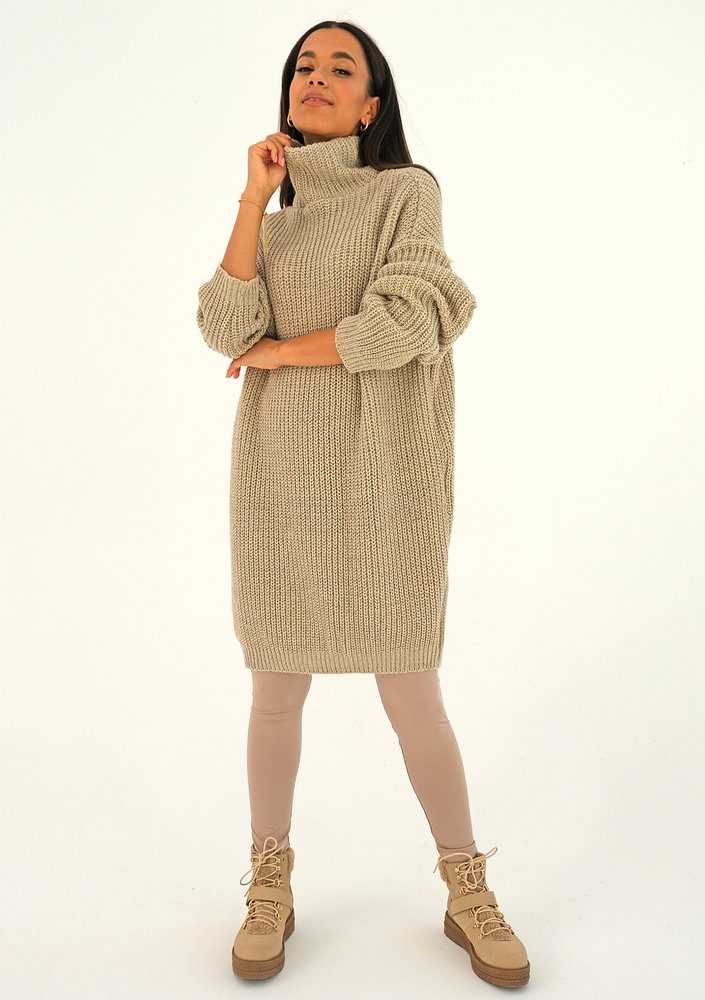 Beige turtleneck sweater with a silver thread