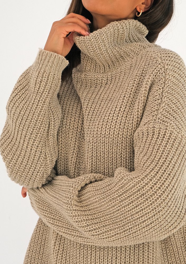 Beige turtleneck sweater with a silver thread