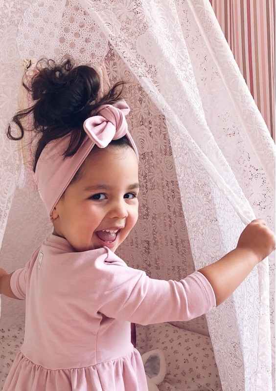 Powder pink headband with a bow