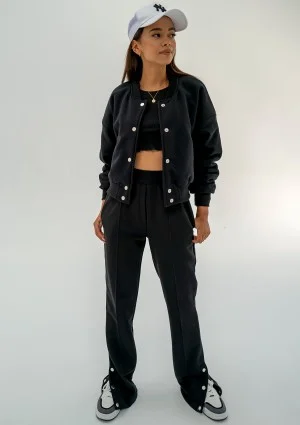 - Black snap-buttoned sweatpants