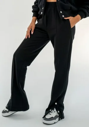 - Black snap-buttoned sweatpants