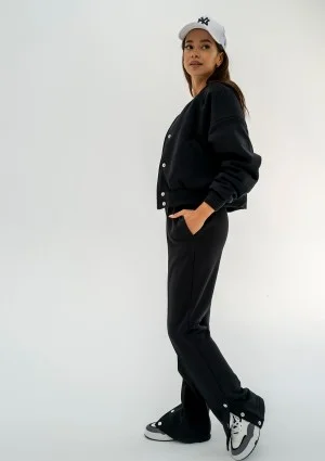 - Black snap-buttoned sweatpants