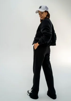 - Black snap-buttoned sweatpants