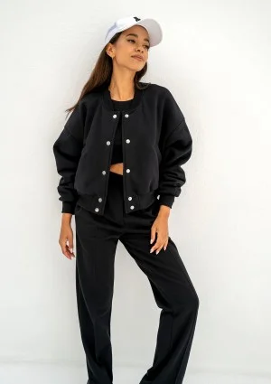 - Black snap-buttoned sweatpants