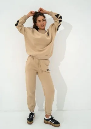 Duve - Beige sweatpants with est 2009 logo