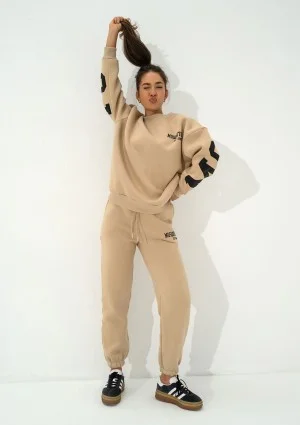 Duve - Beige sweatpants with est 2009 logo