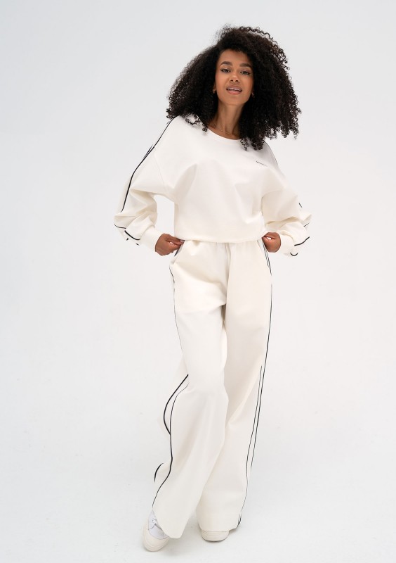 Cody - Ecru pants with trims