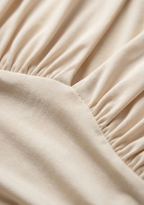 Noire - Creamy draped mini dress