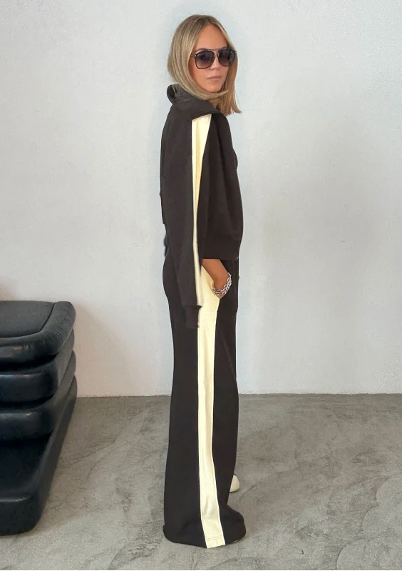 - Dark chocolate brown sweatpants with stripes