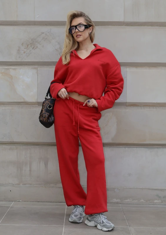 Wells - Cherry red jumper with shoulder pads