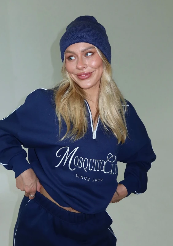 Beanie - Navy blue beanie with an embroidered monochromatic logo